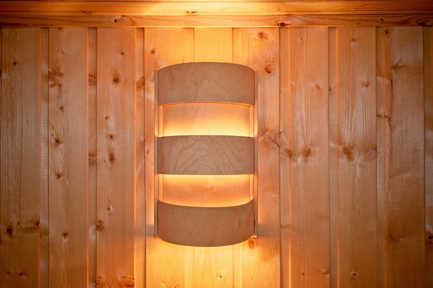 Wooden screen for a lamp in a bath