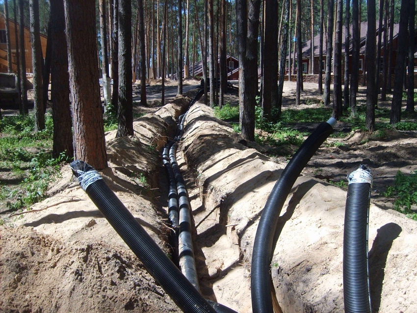 HDPE pipes for cable laying are placed in pre-dug trenches